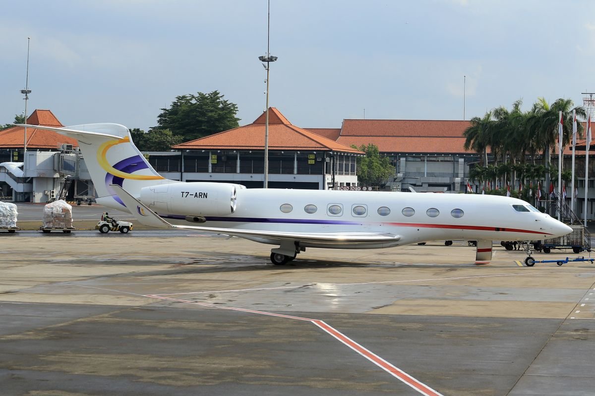 Gulfstream private jet parked on an airport runway